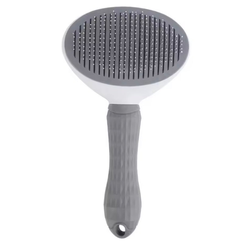 Self cleaning slicker pet brush